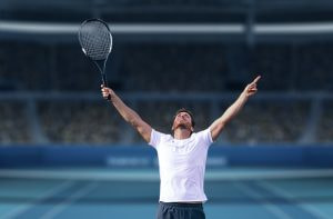 Un tenista levantando los brazos al cielo tras ganar un gran torneo de tenis.